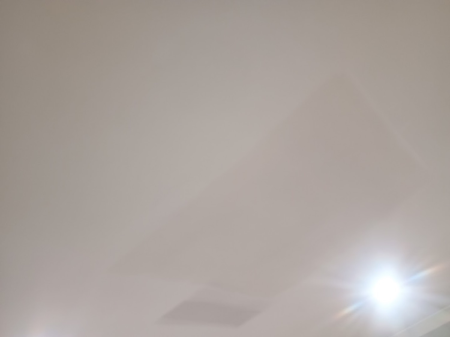 A finished plaster wall catching soft daylight
